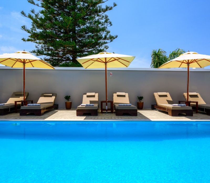 Pool with seats and umbrellas